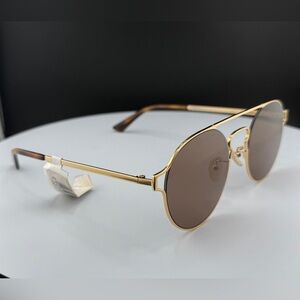 Alexander McQueen MQ0211SA - 002 Gold |
Sunglasses Unisex